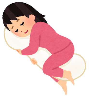 抱き枕を使って眠る妊婦さんのイラスト